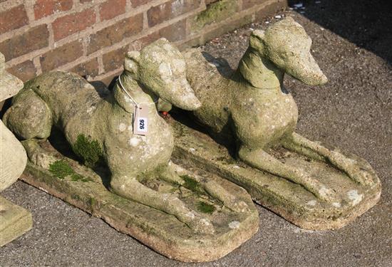 Pair reconstituted stone garden figures of recumbent whippets